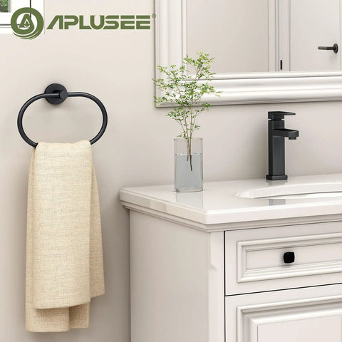 Killer Matte Black Oval Towel Ring Features Smooth Swivel Action Wall Mounted Bathroom Accessory with towel on it.
