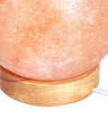 Natural Himalayan Salt Lamp With Wood Base And Dimmer Switch Pink Crystal Sphere close-up on wood base and cord