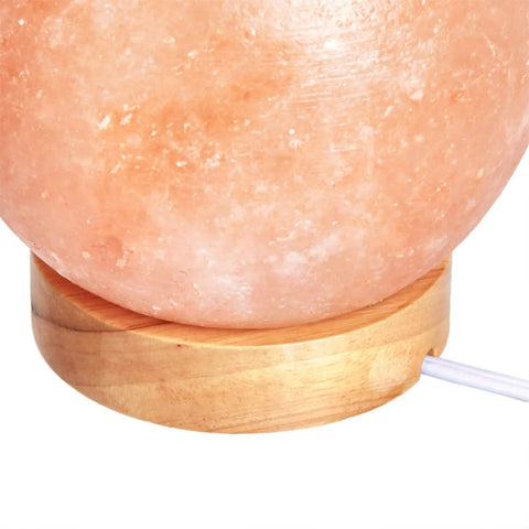 Natural Himalayan Salt Lamp With Wood Base And Dimmer Switch Pink Crystal Sphere close-up on wood base and cord