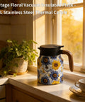 Sunflower Floral 35 Ounce Tea Pot With Infuser Insulated Stainless Steel Kettle shown in a kitchen setting
