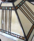 Close-up of Mission Tiffany Style Stained Glass Ceiling Pendant Light with 11 Inch Lampshade in cream and geometric design.