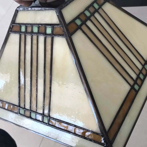 Close-up of Mission Tiffany Style Stained Glass Ceiling Pendant Light with 11 Inch Lampshade in cream and geometric design.