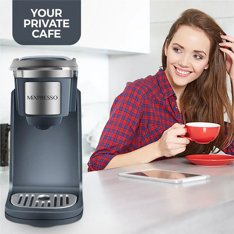 One Touch Single Cup Coffee Brewer With Quick Brew, 12 Oz Grey Coffee Maker, in kitchen setting with user nearby