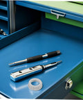 No Fuss 3/4 Inch Plastic Insulating Bushings 100 Pack next to screwdrivers in a toolbox, showcasing insulation and strain relief.