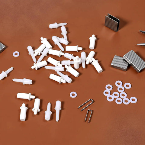 GameChanger Plantation Shutter Repair Kit Features 125 Piece Heavy Duty Louver Staple Set With Spring Loaded Pins And Washers laid out on a flat surface.