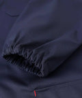 Close-up of navy blue rugged lab coat for men with elastic cuff, perfect for DIY and workshop jobs, size large, poly-cotton fabric.