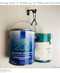 Wall-mounted hook holding two paint cans, demonstrating strong hold up to 15lbs per bracket.