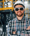 Heavy Duty Welding Safety Glasses And Protective Goggles 10 Pack Featuring Auto Darkening Lenses adjustable fit worn by a smiling man in a helmet.