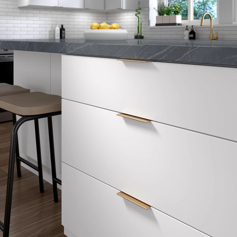 Modern kitchen with Lincoln Collection 5 1/16 Inch Center To Center Brushed Champagne Bronze Cabinet Handles installed on white drawers