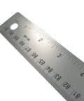 Close-up angle of Stainless Steel Ruler With Non Slip Cork Base 6 Inch For Pro-Grade DIY Crafting And Drafting Warp Free And Bend Resistant Measuring Tool With Easy Read 1/16 And Metric Markings For Clarity showing clear etched markings