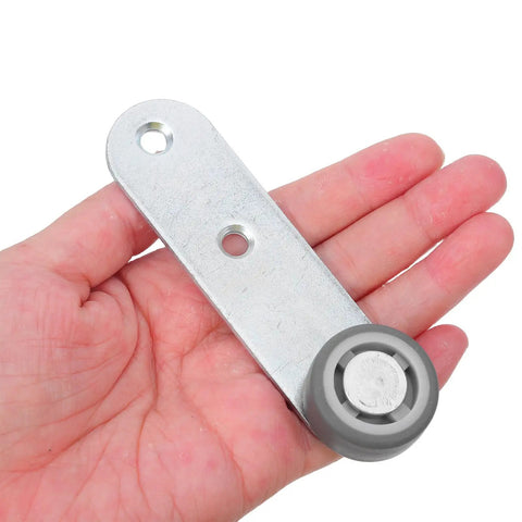 Premium 6 Pack Silver Sliding Door Roller Casters With Reinforced Steel Core And TPE Wheels Includes Anti Sagging Floor Guide For Barn Doors That Glide Damn Smooth Every Time held in hand displaying gray wheel.