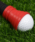 Golf Ball Retriever with Suction Cup Tool in red rubber picking up a golf ball from grass
