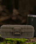 Tough As Nails Heavy Duty Plastic Toolbox With Interlocking Stackable Design And Thick Three Layer Foam Cushioning For Job Site Ready Water Resistant Gear Storage And Drop Safe Protection on a mossy stump.