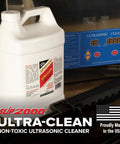 One Gallon Professional Workhorse Ultrasonic Cleaner Fluid Nukes Stubborn Cosmoline Carbon Buildup And Heavy Grease Residue Quickly Wiping Dirtiest Metal Parts Spotless in front of ultrasonic cleaner.