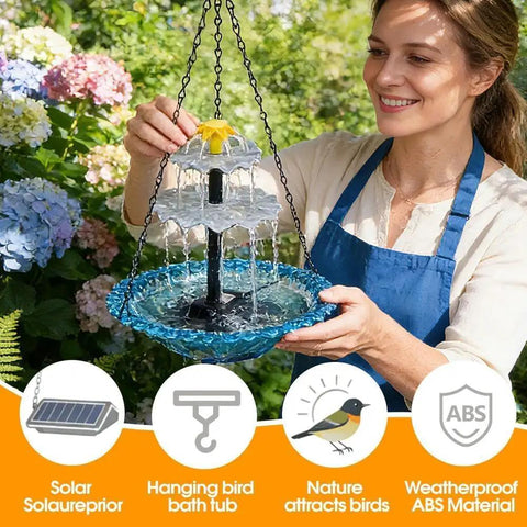 Woman holding solar cascade hanging bird bath fountain with solar pump and bowl, blue finish, for garden yard patio decor