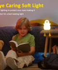 Child reading beside Seagull Silicone Night Light for Kids Portable Rechargeable Bedside Lamp for Nursery with Touch Control