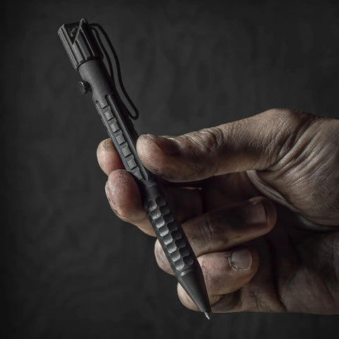 Hand holding All Weather Readiness Metal Tactical Pen With Bolt Action Clicker Glass Breaker Tip Heavy Duty Aluminum Body Black Ink