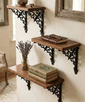 Slick Vintage Black Shelf Brackets Rock Solid Cast Iron L Brackets With Timeless European Scroll Detail Heavy Duty Wall Mount Hardware For A Total Home Makeover Legit Sturdy Decor Support with wooden shelves and plants.
