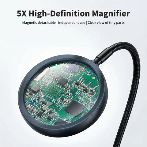 5X magnifying glass on a Versatile Soldering Station With 5X Magnifying Glass, Magnetic Helping Hand And 4 Flexible Arms For Soldering, Assembly, And PCB Repair, Adjustable Vise, 360 Degree Rotation, Perfect For Tinkerers, Hobbyists And Pros magnifying a PCB chip