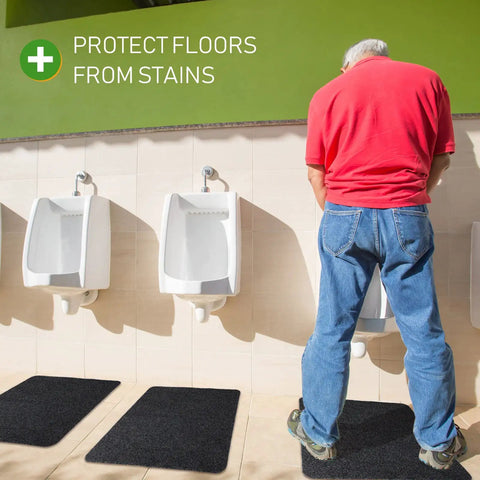 Non Slip Urinal Mats For Men 12 Pack Water Absorbent Bathroom Floor Pads Black 17.3 By 22 Inches in use beneath urinals.