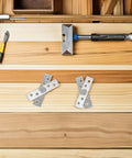 Stainless steel hidden rotation pivot hinges set on wooden surface with tools, for 360-degree concealed door shaft, silent heavy-duty use.