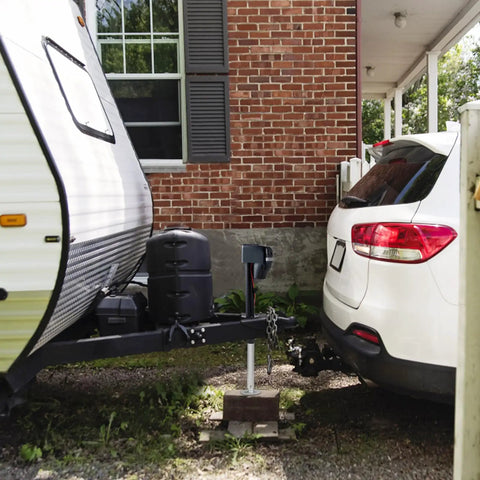 Side view of car hitched to RV with Electric Trailer Jack With 4000 Lbs Capacity And 9.84 To 33.85 Inch Adjustable Lift