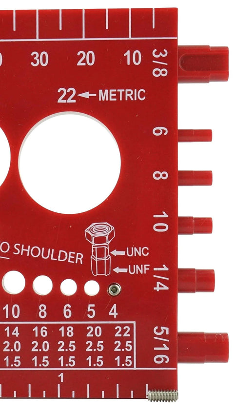 Gauge tool with metric and inch measurements, red plastic, showing 22 metric and various markings