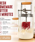 Hand Crank Butter Churner Mason Jar With Ceramic Crocks And Super Easy Old Fashioned Creamery Kit For Making Straight Up Real Homemade Butter in use, splashes of cream visible.