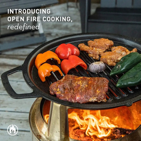 Bonfire Cast Iron Grill Cooking Bundle 2.0 with steaks, veggies on smokeless fire pit outdoors