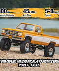 Chevrolet K10 One Eighteen Scale RC Truck with 4WD, dual speed switch, in red with LED lights, on rocky terrain by a lake.