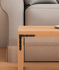 Decorative L Shaped Corner Brackets Set Of 10 In Rustic Black Finish installed on wooden table corner