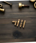 Set Of 25 Solid Brass Concealed Barrel Hinges For Jewelry Boxes And Small Cabinets on dark wooden surface