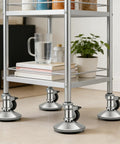 Ditch Those Dang Office Chair Casters With This 5 Pack Of Low Profile Bell Glides on a metal cart, showing sleek smooth bases.