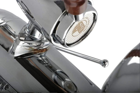 Close-up of the Chrome Brass finish and Bottomless Portafilter of the Straight Fire Manual Lever Espresso Machine.