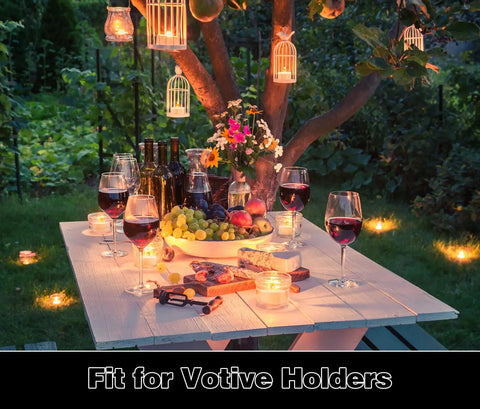 LED Tea Lights 24 Pack Flameless Battery Operated Decor Lights Warm Yellow Flickering Glow on dining table in garden