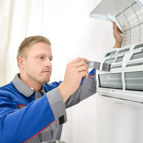 Technician using Fin Comb For Air Conditioner Condenser And Evaporator Fins, Coil Cleaning Brush And Refrigerator Coil Cleaner tool.