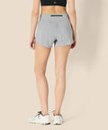 Rear view of Women's Regular Fit Athletic Woven Running Shorts With Ruched Waistband, Zip Pocket in Gray Heather, Size Medium.
