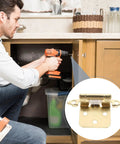 Man installing cabinet with Beefy Heavy Duty Steel Spring Loaded Hinges Five Pack For RV And Cabinet Doors Semi Hidden 1/2 Overlay Design