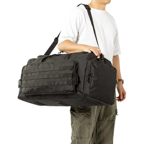 Person holding a 60L Heavy Duty Duffel Travel Bag With Waterproof 900D Exterior And Foldable Design Durable Black Gear Bag.