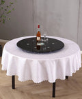 Extra Large 30 Inch Lazy Susan Turntable With Tempered Glass Top Anti Tilt Design And Auxiliary Wheels Rotating Serving Tray on table.