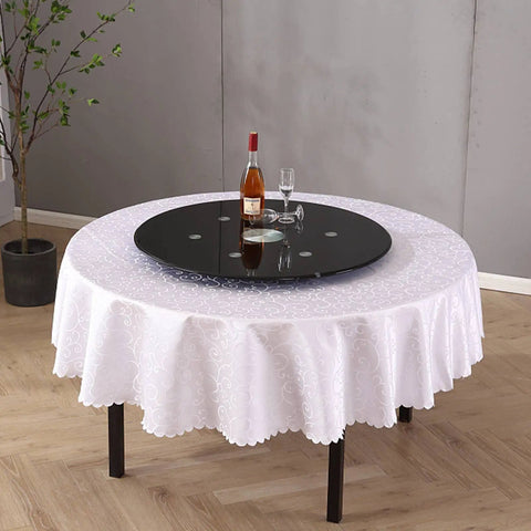 Extra Large 30 Inch Lazy Susan Turntable With Tempered Glass Top Anti Tilt Design And Auxiliary Wheels Rotating Serving Tray on table.