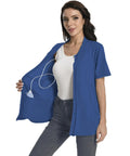 Woman wearing a Cozy Post Surgery Mastectomy Shirt With Drain Pockets For Recovery Breathable Cotton Blend Easy Care in Royal Blue.