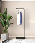 Matte Black Metal Coat Rack Dope Modern Clothing Tree With Heavy Slate Base Sturdy Standing Coat Stand For Entryway Bedroom Hallway Includes Plant Hanger Space Saving Home Decor in room.
