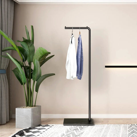 Matte Black Metal Coat Rack Dope Modern Clothing Tree With Heavy Slate Base Sturdy Standing Coat Stand For Entryway Bedroom Hallway Includes Plant Hanger Space Saving Home Decor in room.