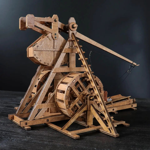 Mini Counterweight Trebuchet With Wheels For Epic Medieval Siege Chariot Catapult Kit DIY 3D Wooden Puzzles Mechanical Model Kit For STEM Projects And Tabletop Play Fun Build It Yourself Toy, wooden model side view