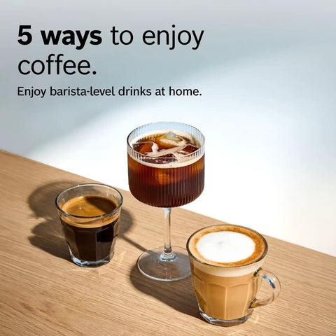 Three cups of coffee on a table; espresso, iced coffee, and cappuccino, illustrating barista-level drinks at home.