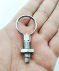 Four Pack Heavy Duty M12 Stainless Steel Spring Plunger With Pull Ring, showcasing a stainless steel plunger in hand.