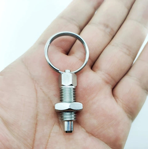 Four Pack Heavy Duty M12 Stainless Steel Spring Plunger With Pull Ring, showcasing a stainless steel plunger in hand.