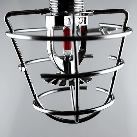 Pair Of Badass Fire Sprinkler Head Guards Made From Rust Resistant Stainless Steel Heavy Duty Cage Covers For One Half And Three Quarter Inch Systems, close-up view.