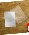 50 Pack Waterproof Card Sleeves With Magnetic Shielding Protectors on wooden surface, transparent PVC card holder displayed.